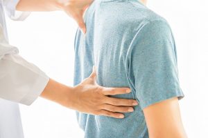 chiropractor with patient