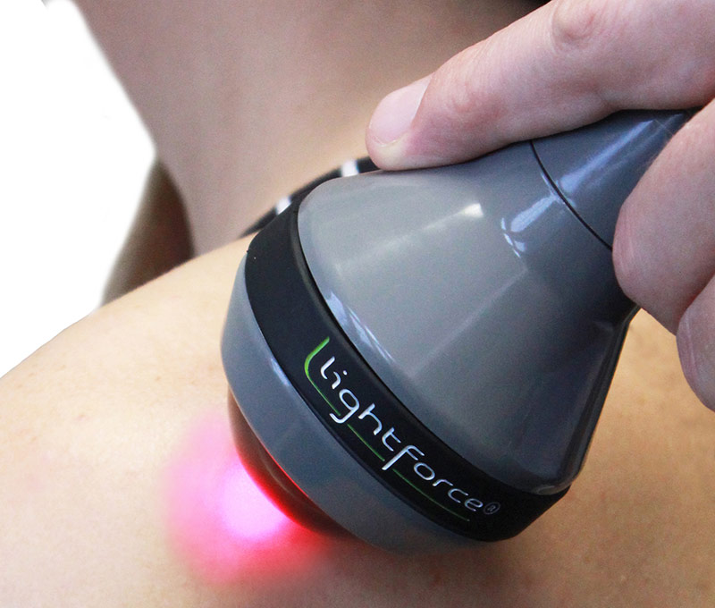 Class 4 LightCure laser therapy treatment on shoulder at Life in Motion Chiropractic in Livonia MI
