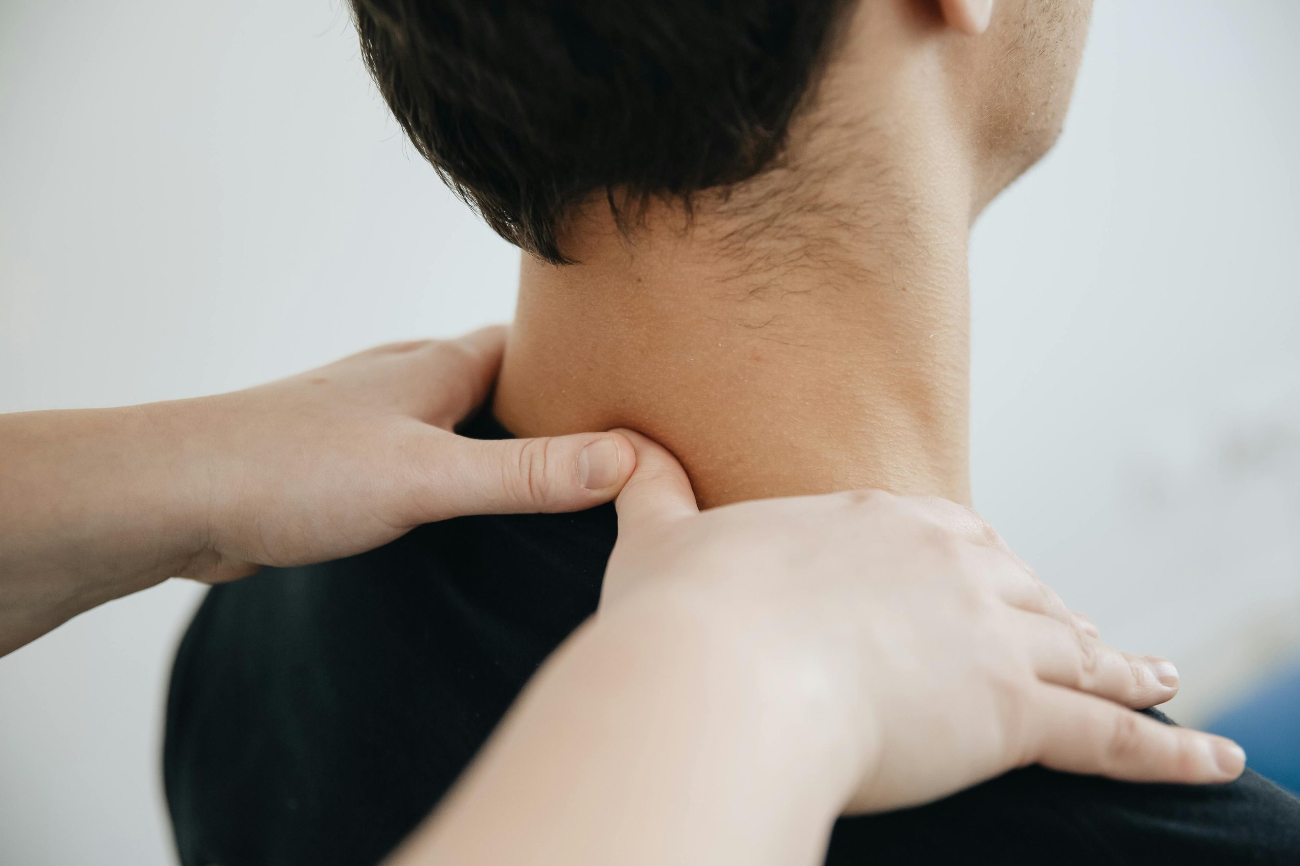 Chiropractic cervical and upper thoracic adjustment for text neck at Life in Motion Chiropractic Livonia MI