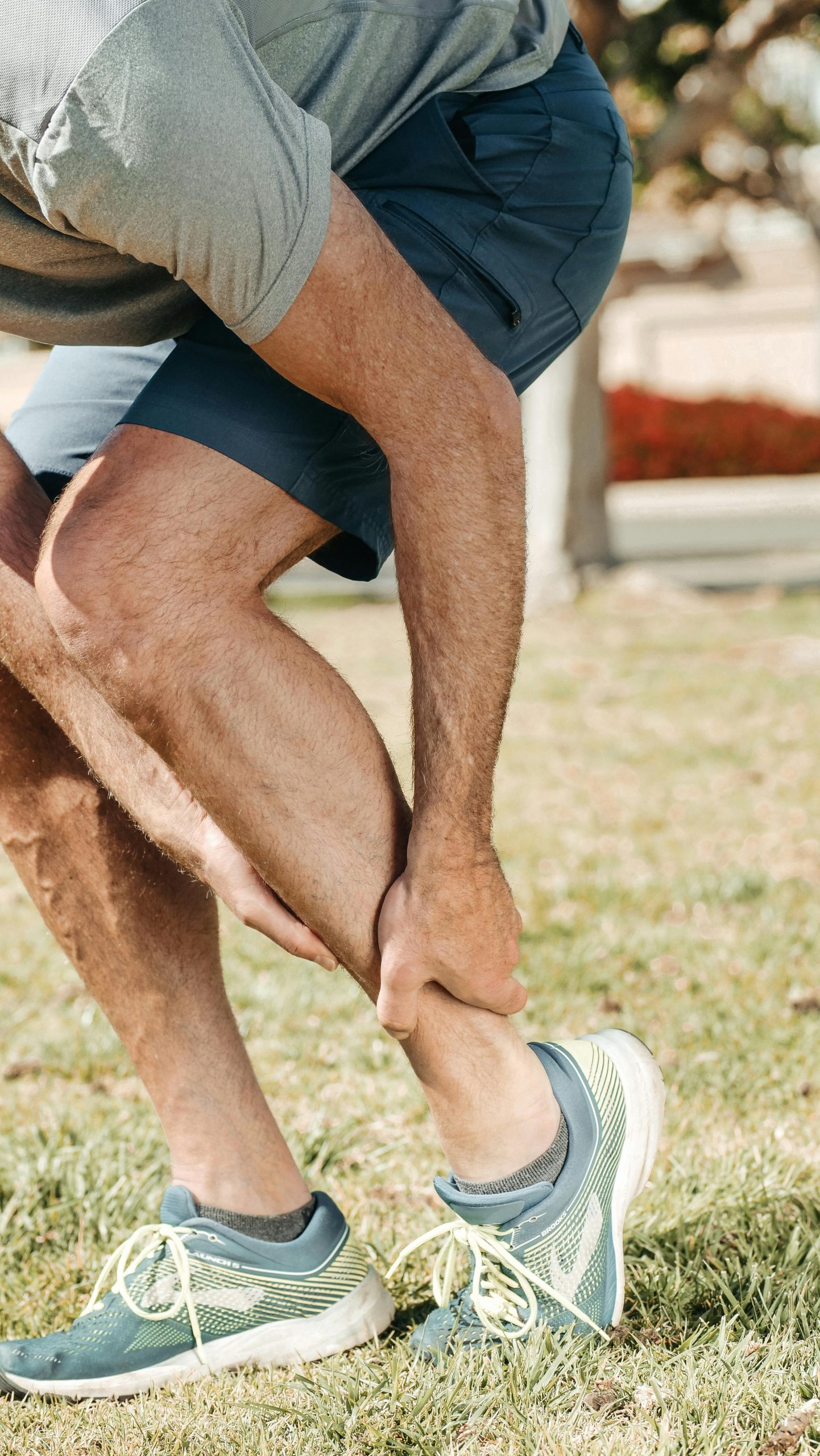 Athlete experiencing ankle pain from a sports injury — Life in Motion Chiropractic Livonia MI