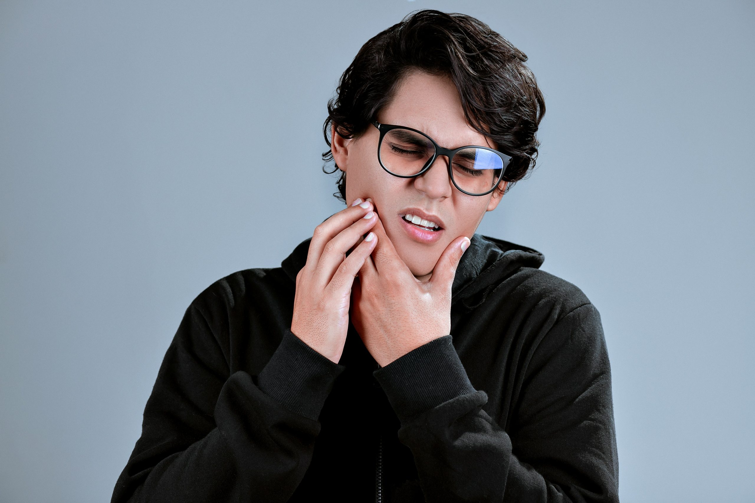 Patient experiencing TMJ dysfunction jaw pain — Life in Motion Chiropractic Livonia MI